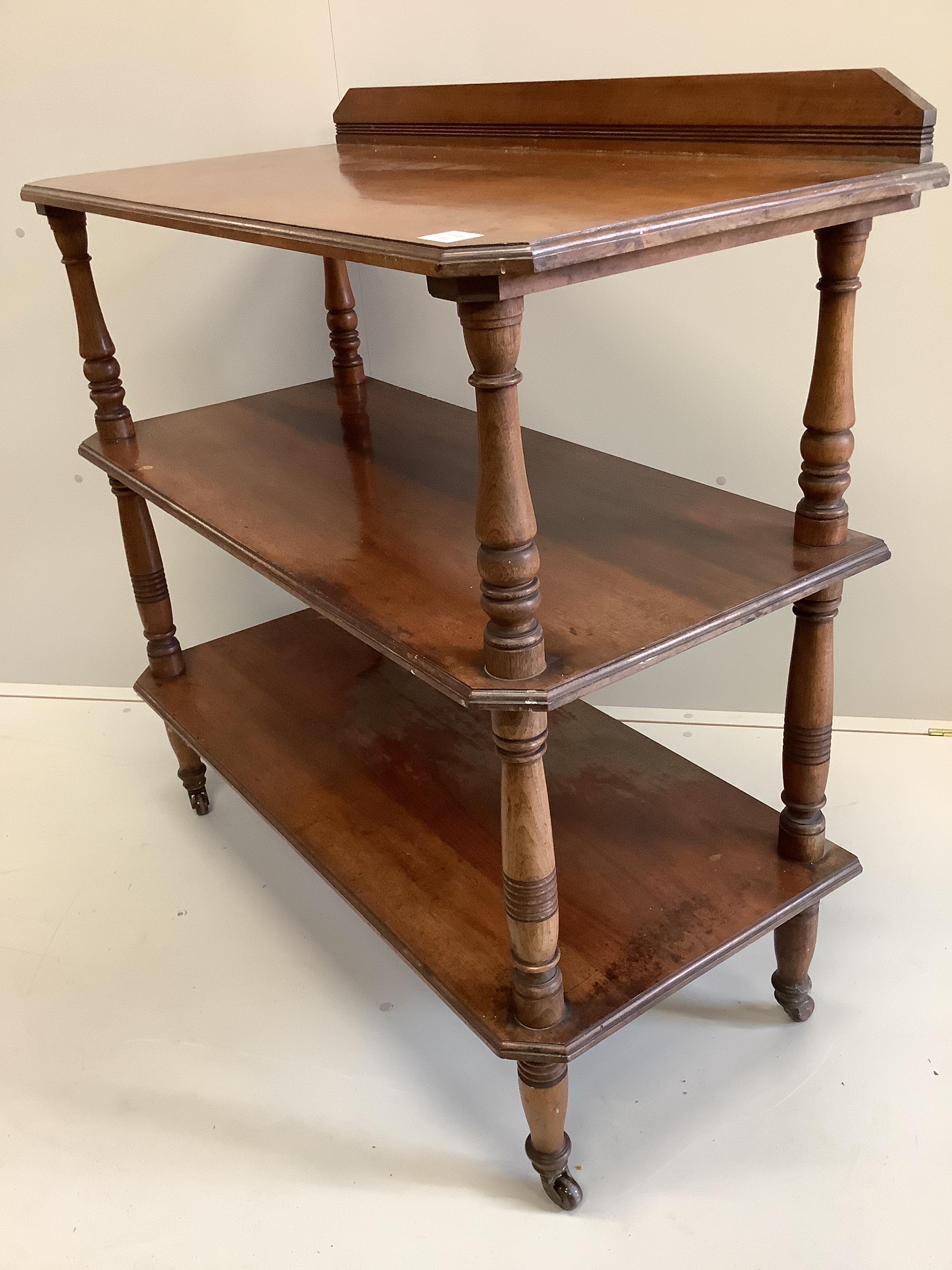 A late Victorian walnut three tier buffet, width 106cm, depth 51cm, height 107cm